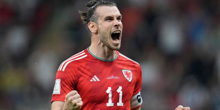 Gareth Bale dari Wales melakukan selebrasi  setelah mencetak gol ke gawang AS. Foto: skysports.com